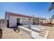 A view of the backyard featuring a patio, a built-in bench, and desert landscaping at 1006 Blue Lantern Dr, Henderson, NV 89015