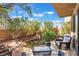 Backyard with pond, patio seating, and lush landscaping, creating an outdoor oasis at 1059 Via Saint Lucia Pl, Henderson, NV 89011