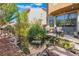 Backyard pond with deck and patio furniture, creating a relaxing outdoor space at 1059 Via Saint Lucia Pl, Henderson, NV 89011