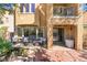 Outdoor seating area with pond and string lights, complemented by a covered patio at 1059 Via Saint Lucia Pl, Henderson, NV 89011