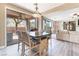 Inviting dining area featuring a stylish table with chairs, adjacent to an outdoor patio through sliding glass doors at 1059 Via Saint Lucia Pl, Henderson, NV 89011