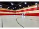 Large gymnasium featuring basketball hoops and a painted stripe decor at 1059 Via Saint Lucia Pl, Henderson, NV 89011