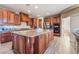 Modern kitchen with stainless steel appliances, granite countertops, and a large island at 1059 Via Saint Lucia Pl, Henderson, NV 89011