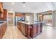 Spacious kitchen features a large center island, granite countertops, and stainless steel appliances at 1059 Via Saint Lucia Pl, Henderson, NV 89011