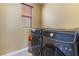 Convenient laundry room with a large washer and dryer at 1059 Via Saint Lucia Pl, Henderson, NV 89011