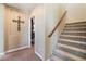 Carpeted stairway with a wood railing, leading to the upper level of the home at 1059 Via Saint Lucia Pl, Henderson, NV 89011