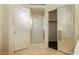 Bathroom with glass-enclosed shower, walk-in closet, and white door at 11204 Newbury Hills Ave, Las Vegas, NV 89138