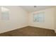 Bedroom with neutral walls and carpet, plus window at 11204 Newbury Hills Ave, Las Vegas, NV 89138