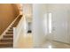 Bright foyer with tile flooring and staircase leading upstairs at 11204 Newbury Hills Ave, Las Vegas, NV 89138