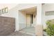 Charming front porch featuring desert style architecture and decorative iron railings at 11204 Newbury Hills Ave, Las Vegas, NV 89138