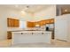 Well-lit kitchen with stainless appliances, long island, and lots of cabinet storage at 11204 Newbury Hills Ave, Las Vegas, NV 89138