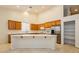 Well-lit kitchen with stainless appliances, long island, and lots of cabinet storage at 11204 Newbury Hills Ave, Las Vegas, NV 89138