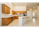 Well-lit kitchen with stainless appliances, long island, and lots of cabinet storage at 11204 Newbury Hills Ave, Las Vegas, NV 89138