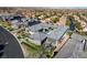 An aerial view showcases the gray roof of a modern home in a suburban neighborhood at 11296 Villa Bellagio Dr, Las Vegas, NV 89141