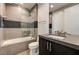 This bathroom boasts a shower-tub combo with tiled walls and modern fixtures at 11296 Villa Bellagio Dr, Las Vegas, NV 89141