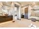 A dual-sink bathroom featuring modern fixtures, tile flooring, and elegant design elements at 11296 Villa Bellagio Dr, Las Vegas, NV 89141