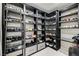 Custom closet with shelving and racks to organize shoes and accessories at 11296 Villa Bellagio Dr, Las Vegas, NV 89141