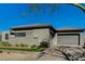 Modern home with manicured lawn, desert landscaping, and a spacious three-car garage at 11296 Villa Bellagio Dr, Las Vegas, NV 89141