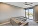 Comfortable living room with neutral gray walls and a sliding glass door at 11296 Villa Bellagio Dr, Las Vegas, NV 89141