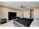 The main bedroom features a contemporary aesthetic with a large TV and modern furniture at 11296 Villa Bellagio Dr, Las Vegas, NV 89141