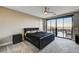 This main bedroom boasts a sliding glass door leading to the outdoor patio at 11296 Villa Bellagio Dr, Las Vegas, NV 89141