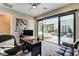 Bright home office with sliding glass doors to outdoor living space, and a modern workspace at 11296 Villa Bellagio Dr, Las Vegas, NV 89141