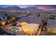 Scenic aerial view showcasing home, backyard with pool, outdoor kitchen, and stunning mountain views at 12217 Tempestad Ave, Las Vegas, NV 89138