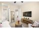 Bright bedroom features a comfortable daybed, wooden console table, and neutral decor at 12217 Tempestad Ave, Las Vegas, NV 89138