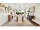 Elegant dining room featuring wainscoting, stylish decor, and a bright, airy atmosphere with an attractive chandelier at 12217 Tempestad Ave, Las Vegas, NV 89138