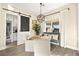 Breakfast nook features a modern light fixture, large window, and comfortable built-in seating at 12217 Tempestad Ave, Las Vegas, NV 89138