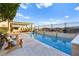 Relaxing backyard pool area with lounge chairs and a view, perfect for leisure at 12217 Tempestad Ave, Las Vegas, NV 89138