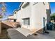 View of backyard patio, block wall, and exterior of home in a residential neighborhood at 2049 Audrey Hepburn St, Las Vegas, NV 89142