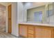 Bathroom with double sinks, a marble countertop, and views into the bedroom at 2049 Audrey Hepburn St, Las Vegas, NV 89142