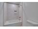 Bathroom showcasing a tub with a shower and niche at 2049 Audrey Hepburn St, Las Vegas, NV 89142