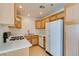 Kitchen featuring wooden cabinetry, modern appliances, and a functional layout at 2049 Audrey Hepburn St, Las Vegas, NV 89142