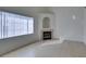 Bright living room with tile flooring, fireplace, and window with blinds at 2049 Audrey Hepburn St, Las Vegas, NV 89142