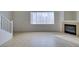 Bright living room with staircase, fireplace, window with blinds, and tile floor at 2049 Audrey Hepburn St, Las Vegas, NV 89142