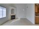 Bright living room with tile flooring, fireplace, neutral walls and kitchen access at 2049 Audrey Hepburn St, Las Vegas, NV 89142