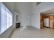 Spacious living room featuring a fireplace, tall ceilings and tiled floors, connected to the kitchen at 2049 Audrey Hepburn St, Las Vegas, NV 89142