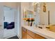 Bright bathroom featuring a white countertop, decorative accents, and a glimpse into the bedroom at 2050 Los Feliz St # 112, Las Vegas, NV 89156