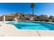 Community pool featuring a clear blue pool and the desert landscape in the background at 2050 Los Feliz St # 112, Las Vegas, NV 89156