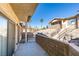 Charming outdoor patio showcasing privacy walls with access to stairs at 2050 Los Feliz St # 112, Las Vegas, NV 89156