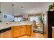 Spacious kitchen featuring wooden cabinets and view to the dining room at 2050 Los Feliz St # 112, Las Vegas, NV 89156