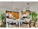 Open kitchen area with bar seating, stainless steel appliances and decorative pendant lights at 2050 Los Feliz St # 112, Las Vegas, NV 89156