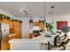 View of the kitchen featuring stainless steel appliances, breakfast bar and wooden cabinetry at 2050 Los Feliz St # 112, Las Vegas, NV 89156