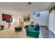 Well-lit living room with comfortable seating and view of the adjacent staircase at 2050 Los Feliz St # 112, Las Vegas, NV 89156