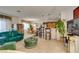 Bright living room with an open concept view of the dining area and the kitchen at 2050 Los Feliz St # 112, Las Vegas, NV 89156