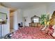 Well-appointed bedroom with a decorative wood bed frame, closet, and an accent chair at 2050 Los Feliz St # 112, Las Vegas, NV 89156