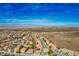 Breathtaking aerial shot showcasing desert and mountain views and a vibrant residential community below at 2176 De Narvik Dr, Henderson, NV 89044