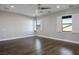 Bright bedroom with hardwood floors, white trim, and shuttered windows at 2176 De Narvik Dr, Henderson, NV 89044